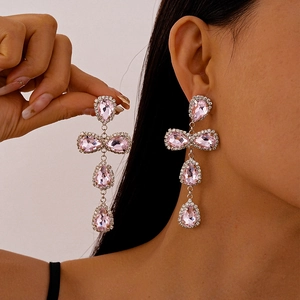 Detailed view of pink teardrop crystal earrings with elegant long tassels and rhinestones