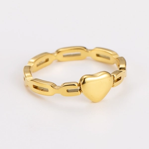 Macro shot of gold hollow chain ring featuring a polished 3D heart-shaped centerpiece