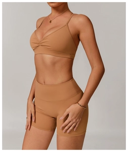Detail shot of the V-neck ruched yoga bra and high waist shorts in coffee brown