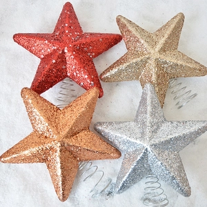 Glittery Christmas tree top stars in red, gold, silver, and rose gold with spring base