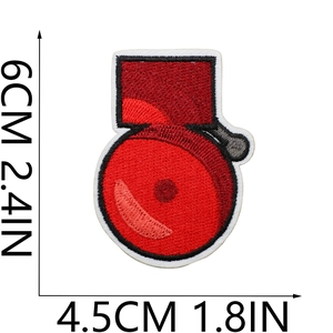 Detailed view of red fire extinguisher patch with precise 6cm x 4.5cm size dimensions