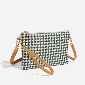 Green and white woven crossbody straw bag with brown PU handle and gold chain strap