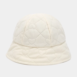 Detailed view of ivory corduroy bucket hat featuring unique heart-shaped quilted stitching