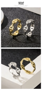 Detail of 18k gold and silver anchor chain rings showing polished link textures