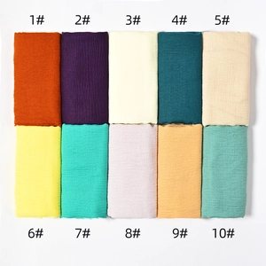 Detail view of cotton linen scarf color chart showcasing ten vibrant solid color options