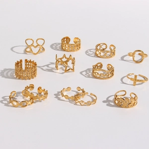 11-piece gold stainless steel ring set with hollow heart and woven star designs