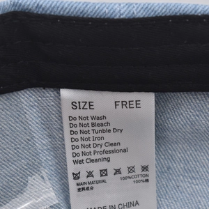 Detail of 100% cotton wash label and care instructions for vintage denim baseball cap