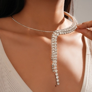 Detail of silver choker necklace featuring cascading rhinestone tassels on a female model