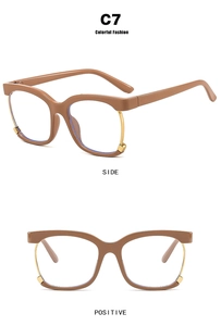 Macro view of brown semi-rimless square eyewear frame with gold metal accents