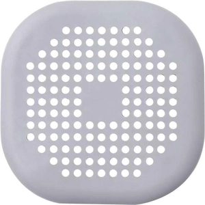 Macro detail of a grey silicone drain cover with dense filter holes for hair trapping