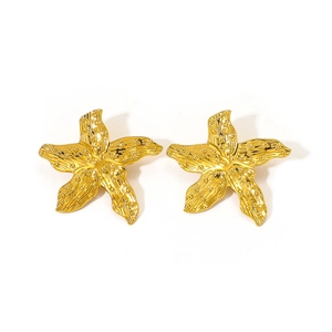 Close-up of golden starfish stud earrings with detailed 18K gold plated texture