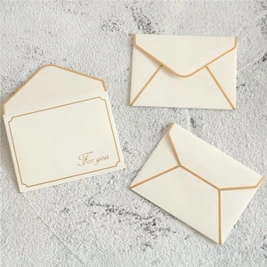 Three elegant cream-white envelopes with gold edges and 'For you' script for gift cards
