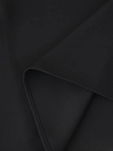 Close-up of high-quality black chiffon fabric texture and detailed edge stitching craftsmanship