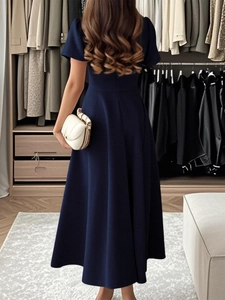 Back view of elegant dark blue A-line midi evening dress with short sleeves and a smooth finish