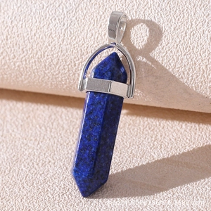 Close-up of a blue natural stone hexagonal column pendant with silver metal clasp