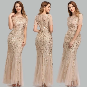 Elegant champagne sequin mermaid evening gown with leaf patterns and mesh sleeves