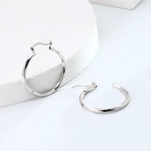 Detailed view of S925 sterling silver twist hoop earrings with textured geometric design
