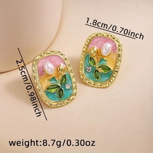 Detail view of oval pearl earrings with vintage enamel and rhinestone dimensions