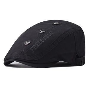 Detail of black cotton duckbill cap with FREESTYLE embroidery and three metal rivets