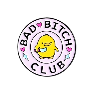 Round enamel pin featuring a cute yellow duck with a knife and Bad Bitch Club text