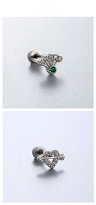 Detail of fan-shaped stud with green gem and silver Cupid heart arrow earring set