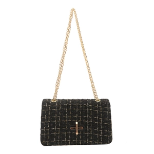 Classic black tweed crossbody bag with gold chain strap and metallic thread accents