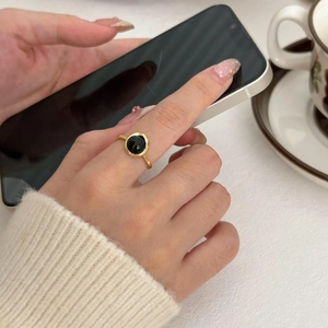 Minimalist S925 sterling silver ring with black onyx stone in a daily lifestyle setting