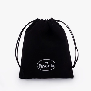 Detail of soft black velvet drawstring pouch featuring my Favorite white printed logo