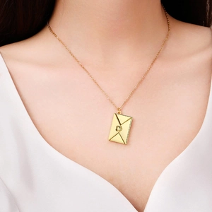 Golden envelope locket necklace with hollow heart on delicate chain for women