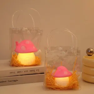 Cute pink mushroom night light in a gift bag with warm LED glow for desk decor