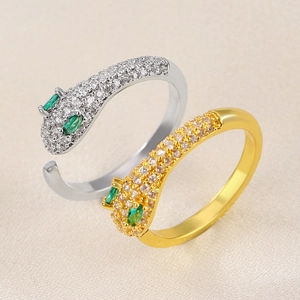 Adjustable leopard ring set in gold and silver with zircon stones and green gem eyes