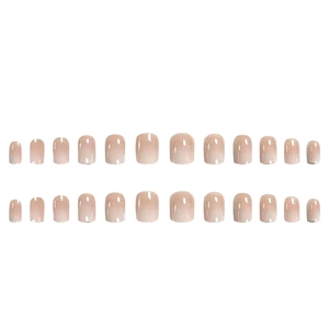 Short french tip press-on nails with elegant nude pink gradient and high gloss finish