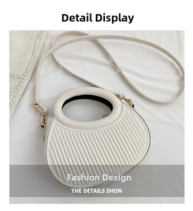 Detailed macro view of white textured saddle bag with unique vertical stripe pattern