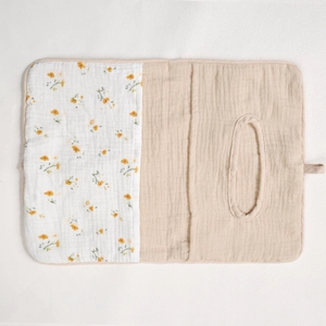 Detail of floral cotton muslin baby organizer bag with hanging loop and soft texture