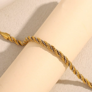 Bracelet chaîne torsadée bicolore en or 18 carats et argent avec détails de perles