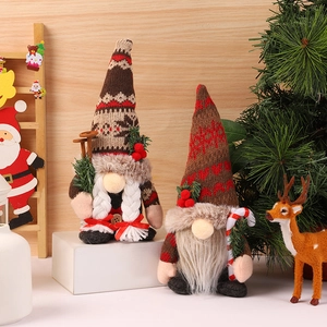 Charming Christmas Gnomes set with knitted hats and pine branches for festive home decor