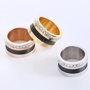 Three-piece stainless steel ring set with Roman numerals, cable inlay and clear zircons