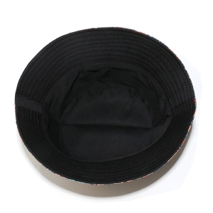Detail of bucket hat interior featuring black cotton lining and paisley ethnic print brim