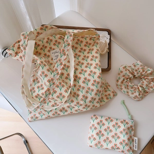 Three-piece floral canvas set including tote bag, small pouch and matching hair scrunchie