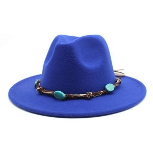 Detail of blue fedora with turquoise beads, brown leather cord and gold chains decoration