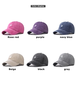 Detailed color display of six vintage washed cotton baseball caps with embroidered U logos