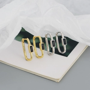 Detail of S925 sterling silver U-shaped earrings featuring rectangle black zircon stones