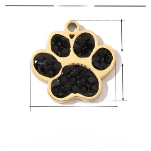 Detailed view of dog paw pendant with dimensions 13mm by 12mm in stainless steel and rhinestones