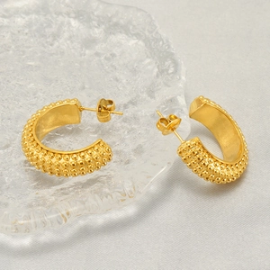 Fashionable golden geometric hoop earrings with textured beaded surface and vintage metallic finish