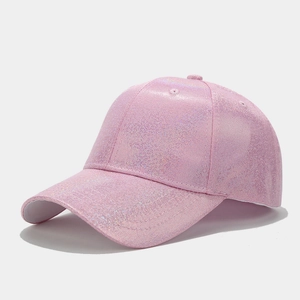 Close-up of sparkling pink glitter texture on the curved brim of this baseball cap