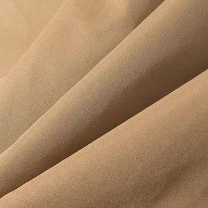 Macro shot of khaki twill fabric texture and durable material of the double-breasted trench coat