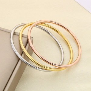 Minimalist stackable 3mm stainless steel bangles in gold, rose gold and silver set