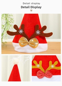 Detail display of a red velvet Christmas hat with glitter reindeer antlers and a bow