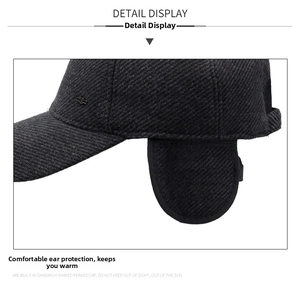 Detail view of winter baseball cap with folded ear flaps and textured wool fabric