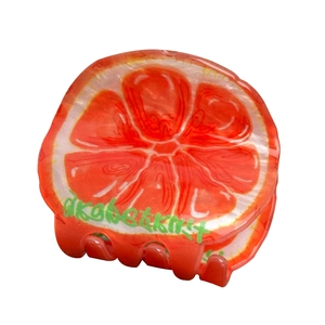 Cute grapefruit-shaped acrylic hair claw clip for women featuring a vibrant fruit design